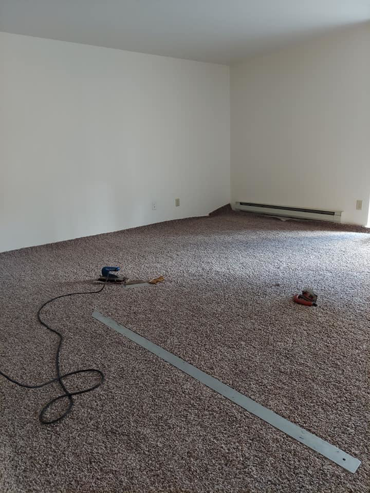 Newly installed carpet with installation tools in a room by Columbia Flooring Group in Troutdale, OR