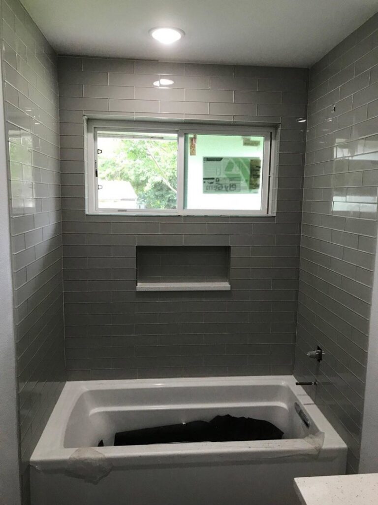 Newly installed beige carpet in a utility room, showcasing a completed carpet installation by Affordable Carpet & Flooring in Dallas, TX.