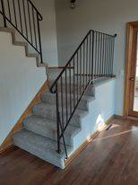 Newly installed light-colored carpet on stairs by Blue Star Flooring in Euless, TX
