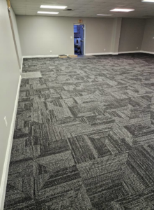 View of newly installed carpet tiles in a commercial space by JB'S floor covering in Semmes, AL