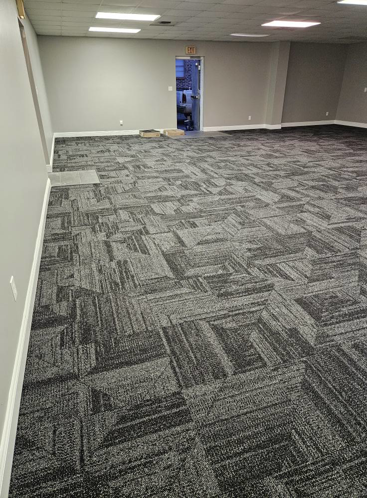 View of newly installed carpet tiles in a commercial space by JB'S floor covering in Semmes, AL