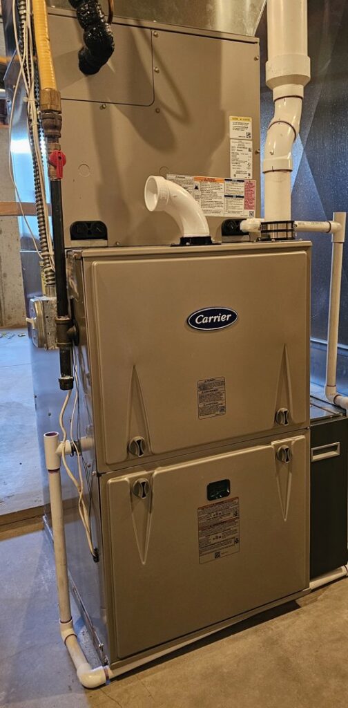 A newly installed Carrier indoor furnace and air handler unit by EZ AIR HVAC in San Antonio, TX