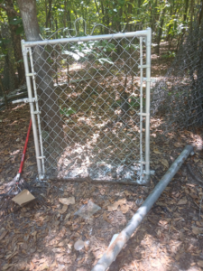 A new chain-link fence gate ready for installation by Jen and Vince and the PreOwned Fence in Augusta, GA.