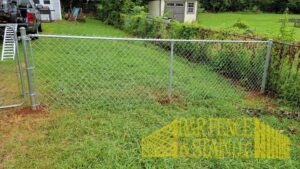 A newly installed chain-link fence by R&R Fence & Stain LLC in Madison, AL.