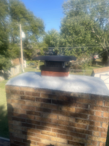 A newly installed chimney cap and clean crown by Chimney Cricket Cleaning Service in Marshfield, MO
