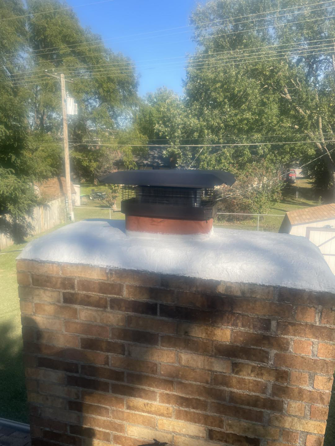 A newly installed chimney cap and clean crown by Chimney Cricket Cleaning Service in Marshfield, MO