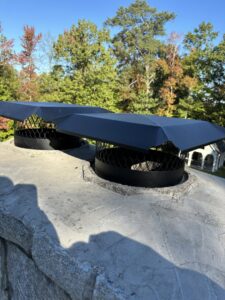 Newly installed chimney caps designed for wildlife exclusion by Smart Solutions Wildlife Removal Specialists in Roswell, GA.