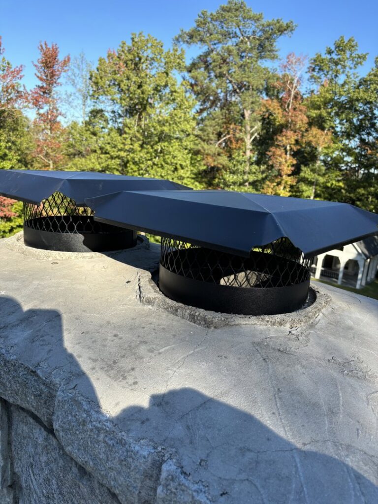Newly installed chimney caps designed for wildlife exclusion by Smart Solutions Wildlife Removal Specialists in Roswell, GA.