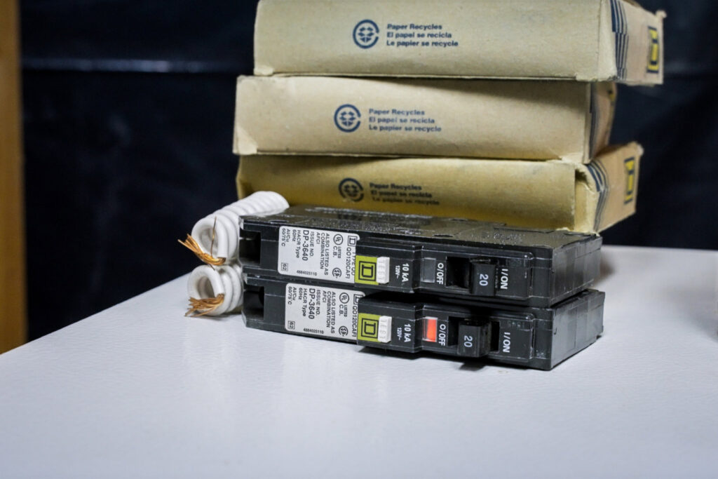 New circuit breakers with packaging, ready for installation by Mister Sparky NWA for electrical upgrades in Springdale, AR.