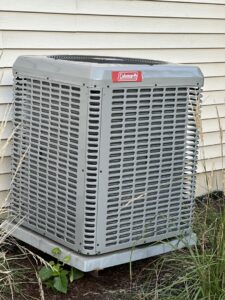 A newly installed Coleman outdoor air conditioning unit by Nacho Heating & Cooling Plus Co. in Crest Hill, IL