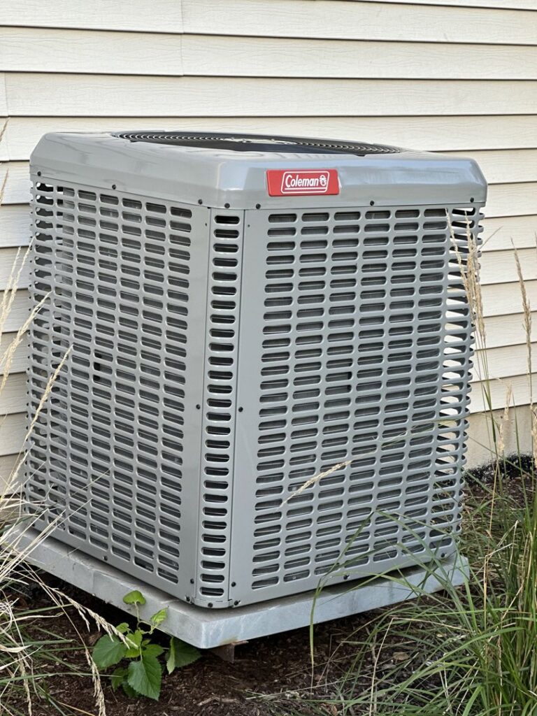 A newly installed Coleman outdoor air conditioning unit by Nacho Heating & Cooling Plus Co. in Crest Hill, IL