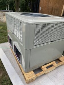 A new commercial HVAC unit delivered on a pallet for installation by Variable Comfort Solutions in Huntington, WV.