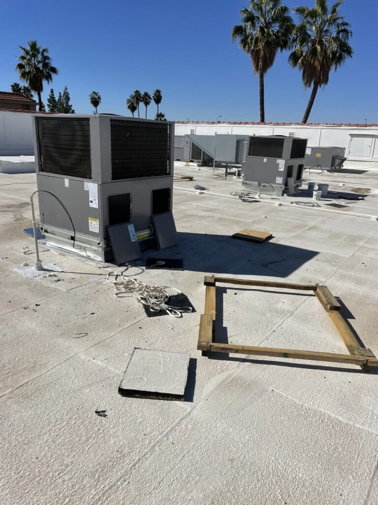 Multiple new commercial rooftop HVAC units being installed by LEWIS AIR LLC in Mesa, AZ.