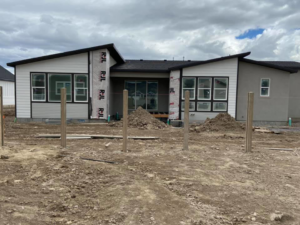 Newly installed concrete fence posts ready for panel attachment by BroKrete Fencing LLC in Salt Lake City, UT
