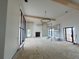 New construction interior with large chandeliers and recessed lighting installed by Warner Electric Service, LLC in Broken Arrow, OK.