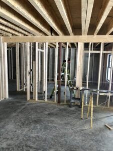 Electrical wiring rough-in during new construction framing by Bacon Electric, LLC in Concord, NH.
