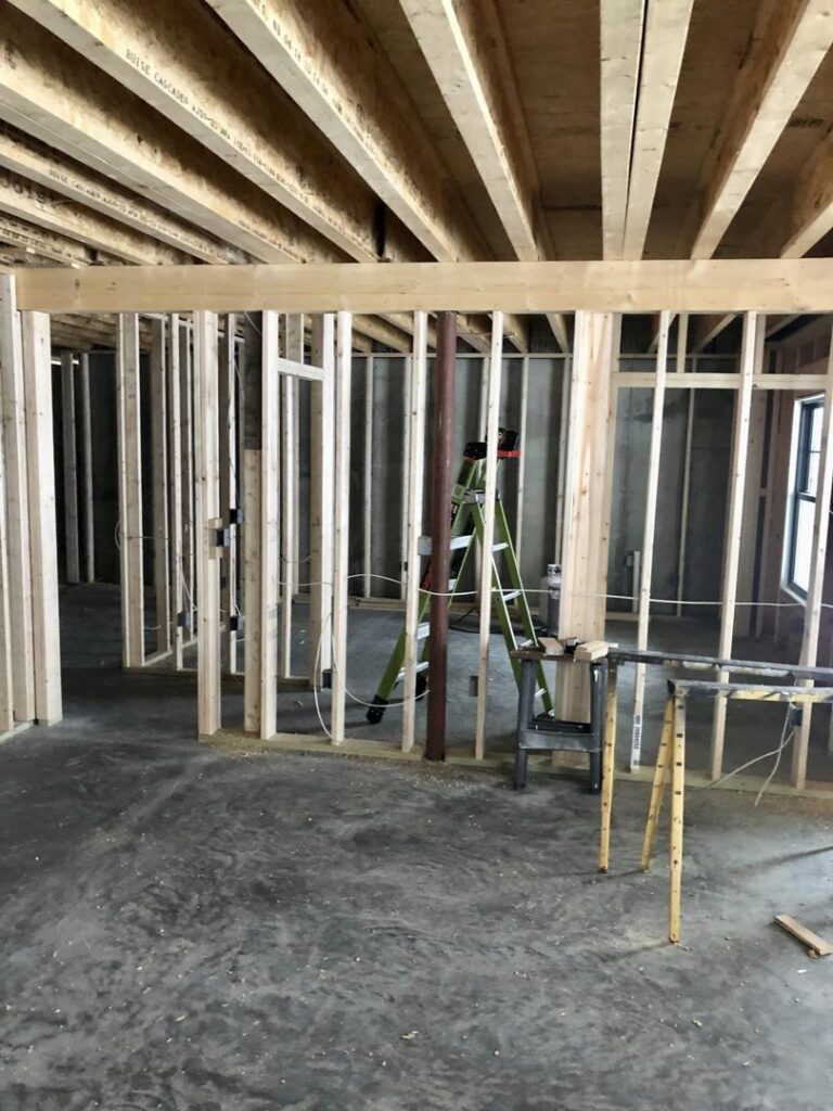Electrical wiring rough-in during new construction framing by Bacon Electric, LLC in Concord, NH.