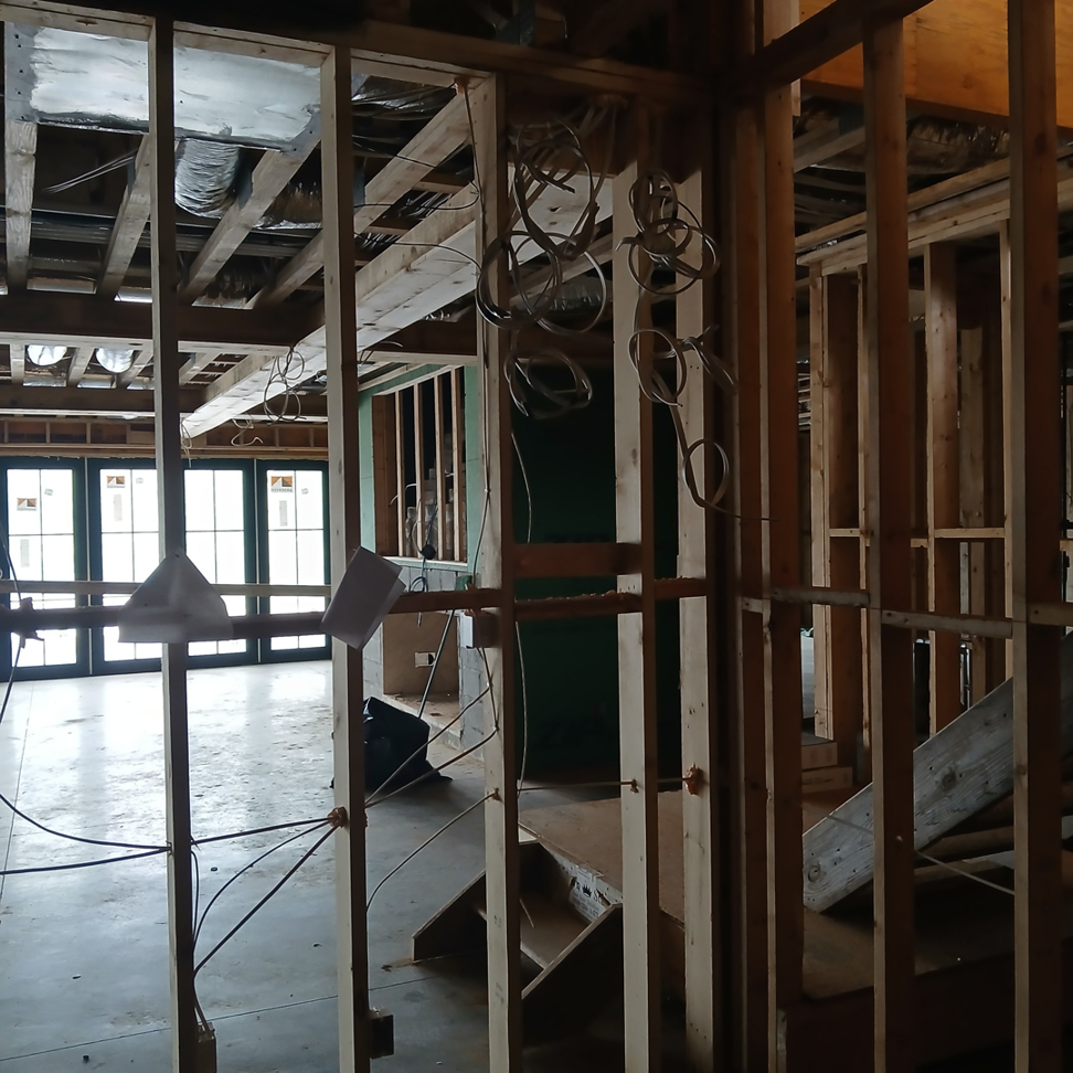 Essential Electric LLC performing new construction electrical wiring in a framed building in Lancaster, KY.