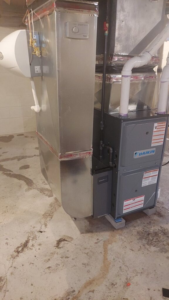 A newly installed Daikin furnace and air handler system by FLAME Heating, Cooling, Plumbing & Electrical in Warren, MI.
