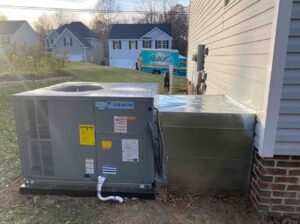 A newly installed Daikin outdoor HVAC unit next to a residential home by Relief Heating and Cooling, LLC in Greensboro, NC.