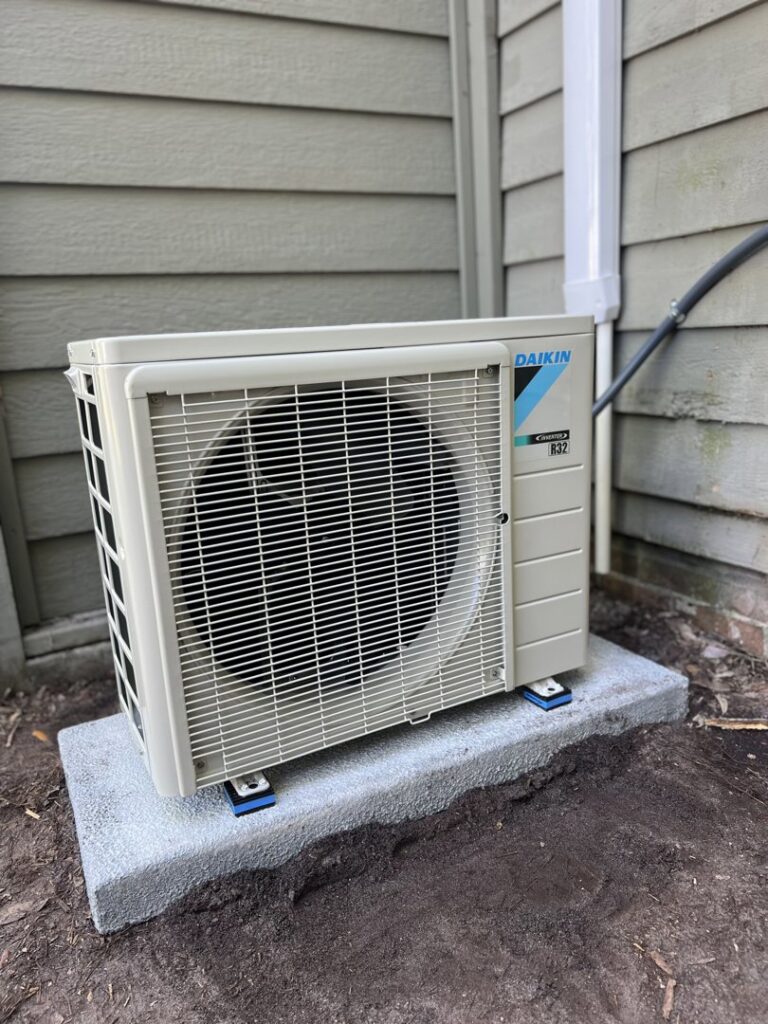 A newly installed Daikin mini-split outdoor unit by Brand Air Heating and Cooling LLC in Wilmington, NC.