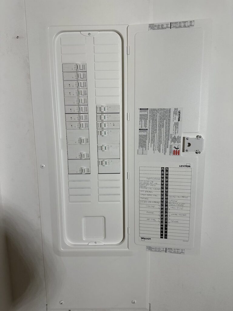 A newly installed and labeled electrical breaker panel by RAD-WIRE ELECTRIC, LLC in Manchester, NH.