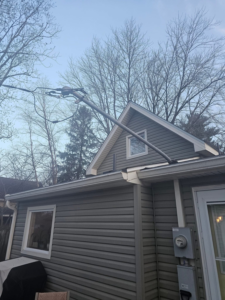 A newly installed electrical mast and service drop connecting power to a home by Heritage Electric LLC in Indianapolis, IN.
