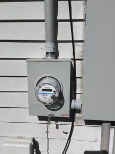 A new electrical meter and conduit installation on a house exterior by Mister Sparky of Greensboro in Greensboro, NC.