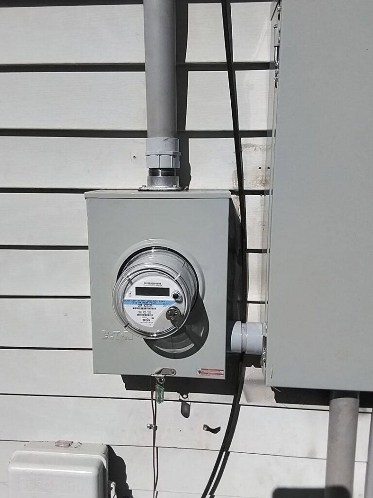 A new electrical meter and conduit installation on a house exterior by Mister Sparky of Greensboro in Greensboro, NC.