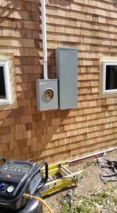 New electrical meter and service panel installation on a home exterior by Accuracy Electric Incorporation in Lakewood, CO.