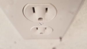 A newly installed white electrical outlet by Your Electrician in Yakima, WA.