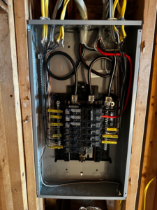 A new electrical panel with labeled circuits installed in a wall by J. K. Quality Electric in Saint Bernard, LA.