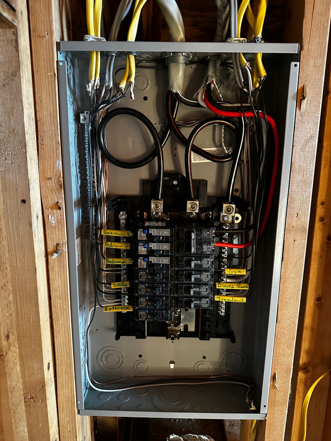 A new electrical panel with labeled circuits installed in a wall by J. K. Quality Electric in Saint Bernard, LA.