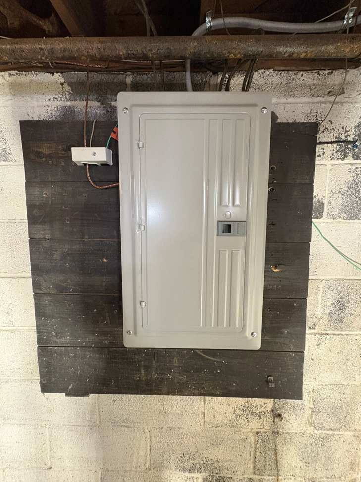 A newly installed electrical panel by J Pownall Electric LLC in Hamilton, NJ, showing a professional upgrade.