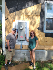 A new outdoor electrical panel installation on a house by John Kivel Electric, LLC in Woodbury, MN.