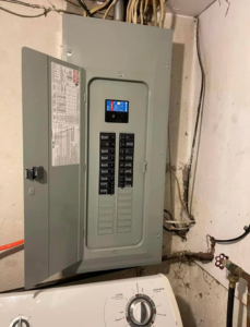 A newly installed electrical panel with the door open, showing breakers, by Plug It In Electric & more in Kansas City, MO.