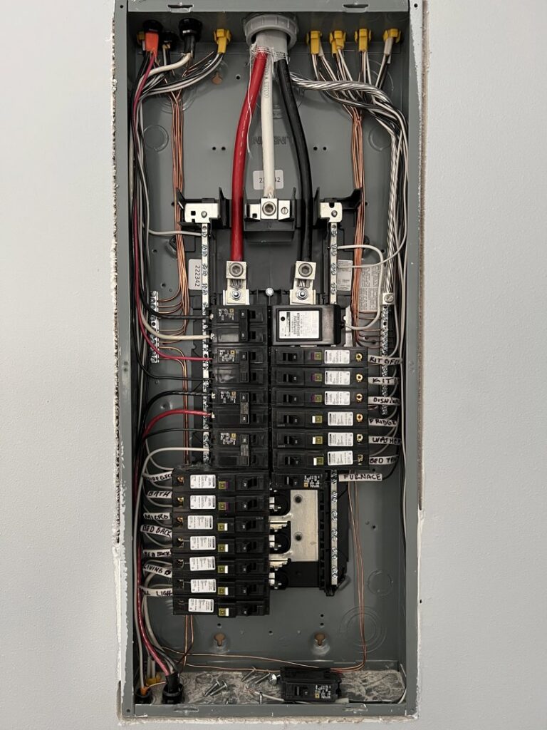 A new electrical panel with labeled circuit breakers and neat wiring installed by F&C Electrical Services LLC in Iowa City, IA.