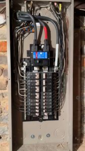 A newly installed electrical panel with organized wiring and breakers by Mister Sparky of Greensboro in Greensboro, NC.