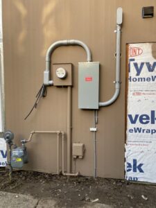 A new electrical service entrance and meter panel installed on a building under construction by Good Contact Electric, LLC in Tacoma, WA.