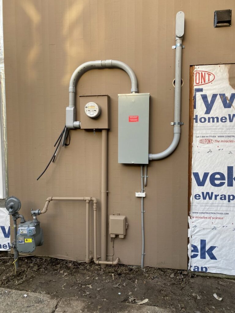 A new electrical service entrance and meter panel installed on a building under construction by Good Contact Electric, LLC in Tacoma, WA.