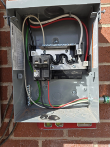 A newly installed or serviced electrical subpanel with clean wiring and a circuit breaker by Desert Wind Electric in Albuquerque, NM