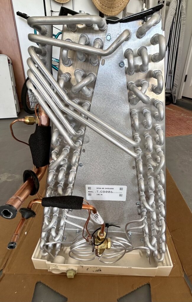 A new evaporator coil, an essential HVAC component, ready for installation by Bluestone Refrigeration LLC in Las Cruces, NM.
