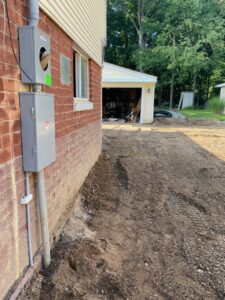 A new exterior electrical meter and service panel installation on a brick house, completed by Titus & Son's Electric in Bluffton, IN.