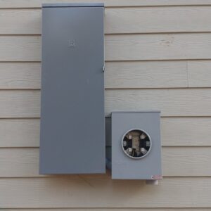New exterior electrical panel and meter base installed on a residential building by Ark Electrical Service in Tomball, TX