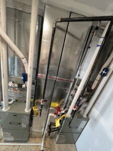 Two new furnaces or air handlers with extensive ductwork and piping installed by TriForce HVAC in Layton, UT