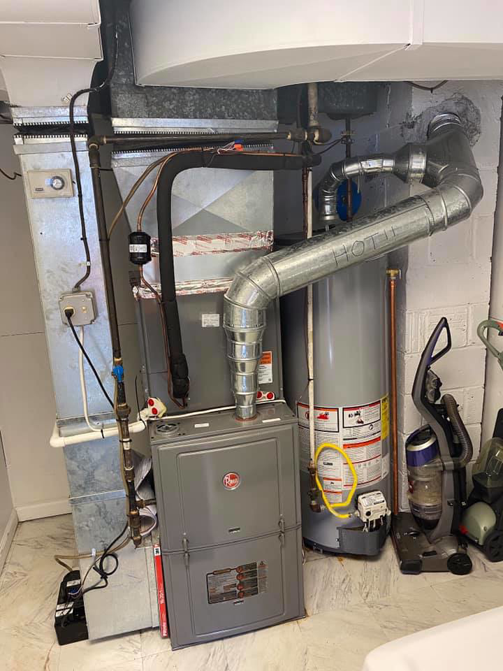 A new Rheem furnace and air handler unit installed with ductwork by Virtues Mechanical LLC in Baltimore, MD.