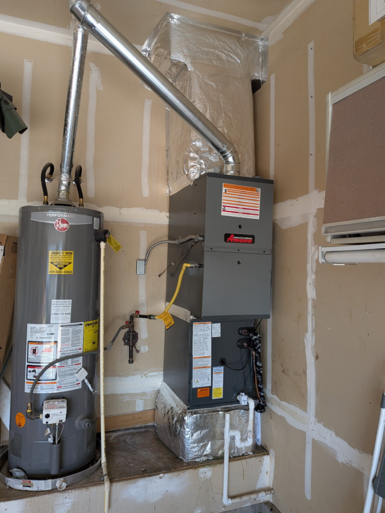 A newly installed furnace and water heater unit by Heritage Heating and Air Conditioning in Nampa, ID