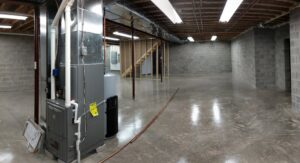 New furnace and ductwork installation in an unfinished basement by Huether Heating & Cooling Inc in Rochester, NY.