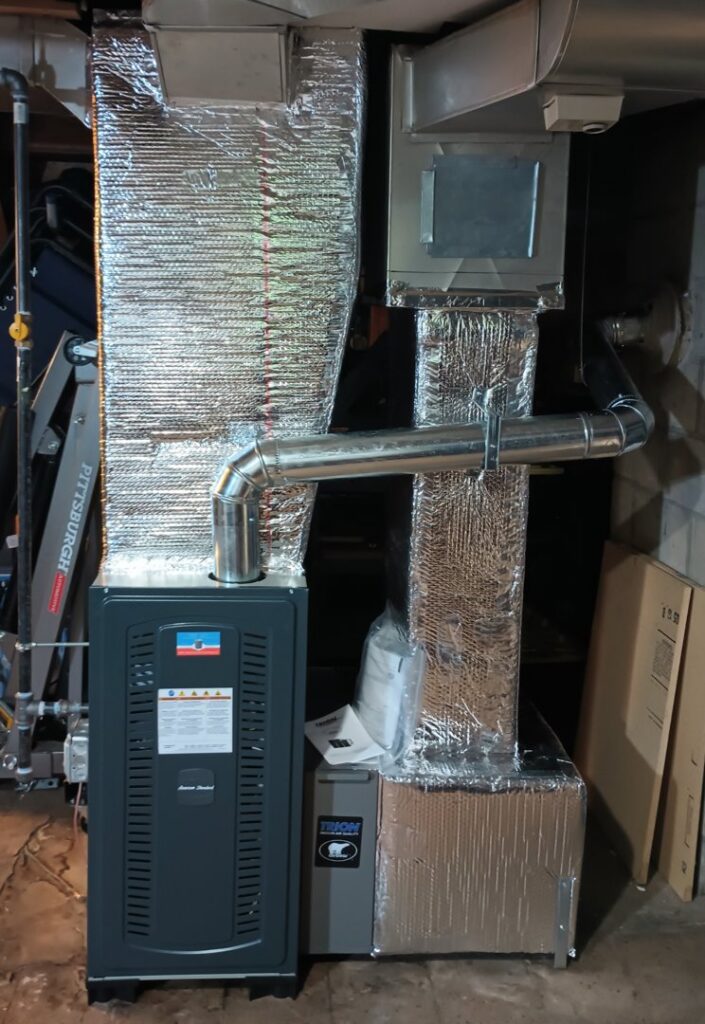 A new furnace and ductwork installation in a basement by MAC Heating and Cooling LLC in Waterbury, CT.