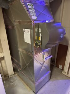 A newly installed furnace and ductwork system in a residential basement by Apollo Heating and Air in Bellevue, NE.